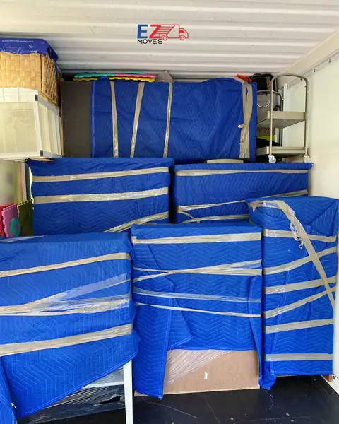 Furniture protected with moving blankets and wrap